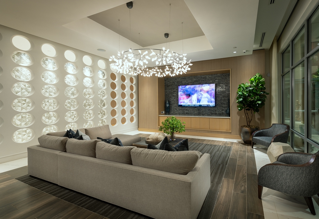 Cirro luxury apartments' indoor lounge in King of Prussia, PA, featuring cozy furniture & a TV.